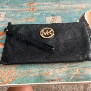 Michael Kors black wristlet, gently used.